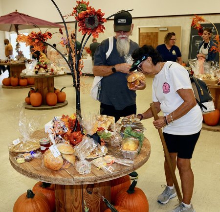 Guests check out the bake sale featuring cakes, pies, Portuguese sweets and much more at the MIQ Fall Festival.